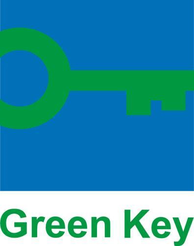 In the picture, the Green Key certification logo with a green key on a blue background and the writing "Green Key" in green.